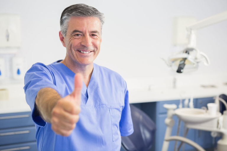 Portrait Of Happy Dentist With Thumbs Up In Dental Clinic Xanthelasma